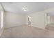 Large carpeted bedroom with a window and access to a bathroom at 11340 Involute Pl # 100, Raleigh, NC 27617