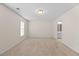 Spacious carpeted bedroom with a large window and access to an ensuite bathroom at 11340 Involute Pl # 100, Raleigh, NC 27617