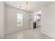 Charming dining area adjacent to the kitchen with tiled flooring and a modern chandelier at 11340 Involute Pl # 100, Raleigh, NC 27617