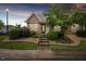 Charming exterior featuring brick accents, landscaping, and a stone walkway at 11340 Involute Pl # 100, Raleigh, NC 27617