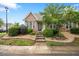 Charming brick and stone home with inviting front garden and well-maintained landscaping at 11340 Involute Pl # 100, Raleigh, NC 27617