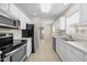 Bright kitchen features stainless steel appliances, white cabinets, and plenty of countertop space at 11340 Involute Pl # 100, Raleigh, NC 27617