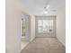 Cozy living room with lots of natural light coming from two windows and a door at 11340 Involute Pl # 100, Raleigh, NC 27617