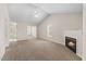 Spacious living room with fireplace, great light and a seamless flow to adjacent spaces at 11340 Involute Pl # 100, Raleigh, NC 27617
