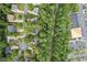 Aerial view of the property at 115 Nuttree Way nestled among lush trees near Tobacco Trail at 115 Nuttree Way, Durham, NC 27713