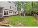 Spacious backyard featuring a playset and manicured lawn at 115 Nuttree Way, Durham, NC 27713