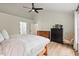 Bedroom featuring high ceilings, light walls, wood floors and lots of natural light at 115 Nuttree Way, Durham, NC 27713