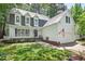 Charming two-story home with a white picket fence and well-manicured lawn at 115 Nuttree Way, Durham, NC 27713