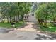 Two-story home with a manicured front yard and spacious driveway at 115 Nuttree Way, Durham, NC 27713