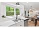 Updated kitchen features a breakfast nook and stainless steel appliances at 115 Nuttree Way, Durham, NC 27713
