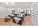 Spacious living room with shiplap walls, a modern fireplace, and an open floor plan at 115 Nuttree Way, Durham, NC 27713