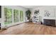 Cozy living room with hardwood floors and ample natural light from large windows at 115 Nuttree Way, Durham, NC 27713