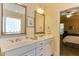 Well-lit primary bath boasts double sinks and vanities at 119 Marykirk Pl, Garner, NC 27529