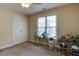 Bedroom with a window, plants, and a ceiling fan at 119 Marykirk Pl, Garner, NC 27529