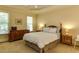 Comfortable bedroom features neutral colors, tray ceiling, and plush carpeting at 119 Marykirk Pl, Garner, NC 27529