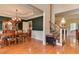 Open concept dining area with hardwood floors, chandelier, and stairs leading to the second level at 119 Marykirk Pl, Garner, NC 27529