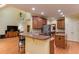 Spacious kitchen boasts a breakfast bar, stainless steel appliances, and custom cabinetry at 119 Marykirk Pl, Garner, NC 27529
