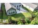 Aerial view of a house with a well-manicured lawn and patio at 120 Bramble Ln, Clayton, NC 27527