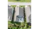 Aerial view of a home surrounded by green lawns and a cozy patio area at 120 Bramble Ln, Clayton, NC 27527