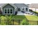 Beautiful backyard with a patio, lush greenery, and a privacy fence at 120 Bramble Ln, Clayton, NC 27527