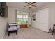 Bedroom featuring a Murphy bed, sitting area, ceiling fan, and plenty of natural light at 120 Bramble Ln, Clayton, NC 27527