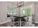 Bright dining area with large windows and stylish table set at 120 Bramble Ln, Clayton, NC 27527
