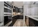 Contemporary kitchen with dark cabinets, stainless steel appliances, and a spacious layout at 120 Bramble Ln, Clayton, NC 27527