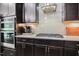 Contemporary kitchen with sleek appliances, custom cabinetry, and stylish countertop at 120 Bramble Ln, Clayton, NC 27527