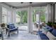 Inviting sunroom features large windows offering great outdoor views at 120 Bramble Ln, Clayton, NC 27527