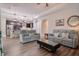 Open living room featuring recessed lighting and connecting to the kitchen with island seating at 120 Bramble Ln, Clayton, NC 27527