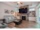 Comfortable living room with a stone fireplace and built-in shelving at 120 Bramble Ln, Clayton, NC 27527