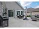 View of the patio featuring a dining area with lush green landscape around it at 120 Bramble Ln, Clayton, NC 27527