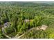A beautiful home surrounded by a dense forest, offering a sense of peace and tranquility at 121 Pheasant Ct, Pittsboro, NC 27312