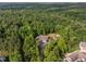 Secluded home nestled in a lush green forest, offering privacy and natural beauty at 121 Pheasant Ct, Pittsboro, NC 27312