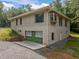 Lower-level two-car garage with a concrete driveway and new Zip System sheathing at 121 Pheasant Ct, Pittsboro, NC 27312