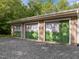 Exterior view of a three-car garage with new Zip System sheathing, ready for finishing at 121 Pheasant Ct, Pittsboro, NC 27312