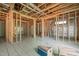 Exposed wood framing and radiant floor heating system in a unfinished living room at 121 Pheasant Ct, Pittsboro, NC 27312