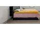 Bright bedroom featuring a colorful bed and modern furnishings at 122 Swansboro Ln, Chapel Hill, NC 27516