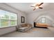 Cozy bedroom featuring angled ceilings, lots of natural light and neutral colors at 122 Swansboro Ln, Chapel Hill, NC 27516