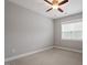Cozy bedroom featuring a ceiling fan, a bright window and carpet flooring at 122 Swansboro Ln, Chapel Hill, NC 27516
