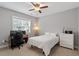 Bedroom with a fan, window, desk and chair, dresser, and bed at 122 Swansboro Ln, Chapel Hill, NC 27516