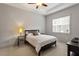 Neutral bedroom featuring a ceiling fan, a bright window and carpet flooring at 122 Swansboro Ln, Chapel Hill, NC 27516