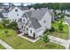 Gorgeous two-story home featuring gray siding, a stone facade, and a meticulously landscaped yard at 122 Swansboro Ln, Chapel Hill, NC 27516