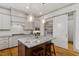 Elegant kitchen featuring stainless steel appliances and a granite countertop island at 122 Swansboro Ln, Chapel Hill, NC 27516