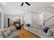 Bright living room with open floor plan, hardwood floors, and modern furnishings at 122 Swansboro Ln, Chapel Hill, NC 27516