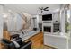 Open living room with a fireplace, built-in shelves and sliding doors to backyard at 122 Swansboro Ln, Chapel Hill, NC 27516