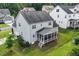 Beautiful light gray home with a screened-in porch and a well-manicured lawn at 122 Swansboro Ln, Chapel Hill, NC 27516
