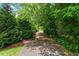 Paved walking trail lined by lush greenery, perfect for a peaceful stroll at 122 Swansboro Ln, Chapel Hill, NC 27516