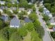 Aerial view of a neighborhood featuring well-maintained homes and lush greenery at 12501 Garden Tree Ln, Raleigh, NC 27614