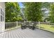 Relaxing back deck with rocking chairs overlooking the backyard at 12501 Garden Tree Ln, Raleigh, NC 27614